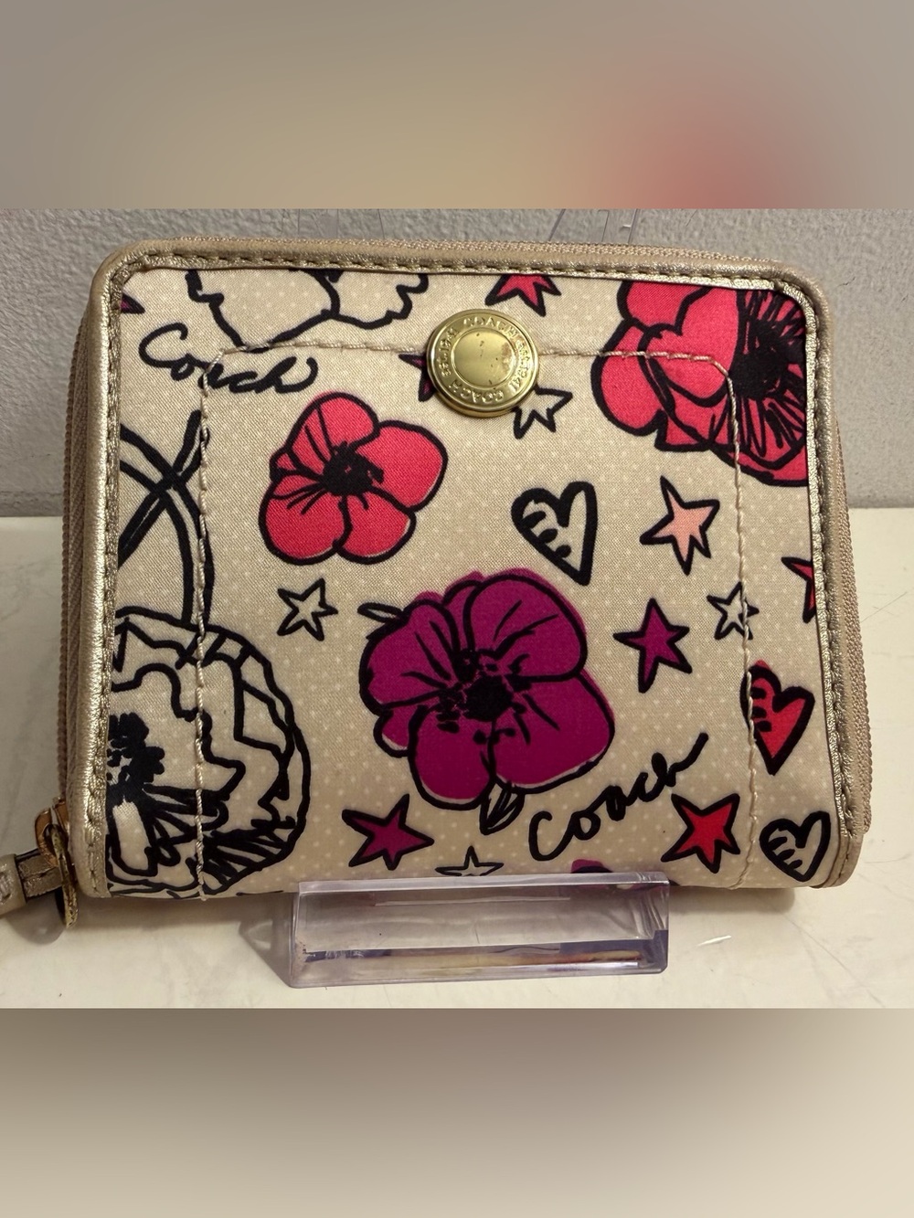 Coach Poppy Floral Graffiti zip around wallet.